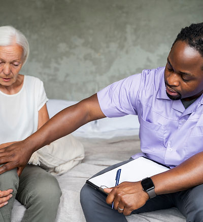 male-social-worker-taking-care-old-woman.jpg