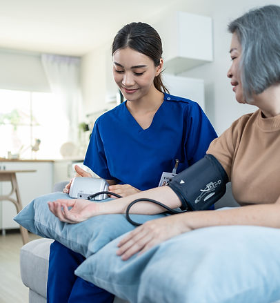 asian_caregiver_doctor_examine_older_patient_use_blood_pressure.jpg