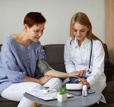 covid-recovery-center-female-doctor-checking-elder-patient-s-blood-pressure.jpg