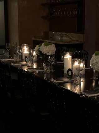 Candlelit black and white dinner tablescape for a 50th birthday