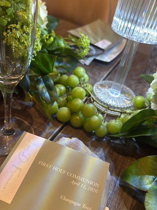 Green floral first communion tablescape with a custom menu in Toronto
