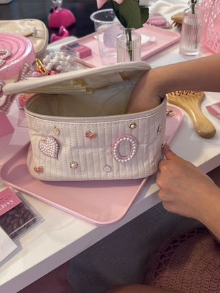 Child decorating a personalized jewellery bag at a Toronto workshop party