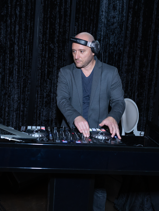 DJ performing at a corporate client appreciation party