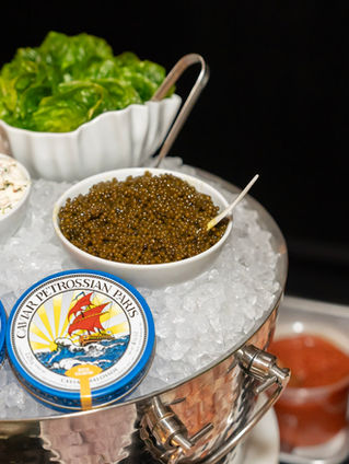 Caviar and gourmet toppings station at a Toronto milestone party