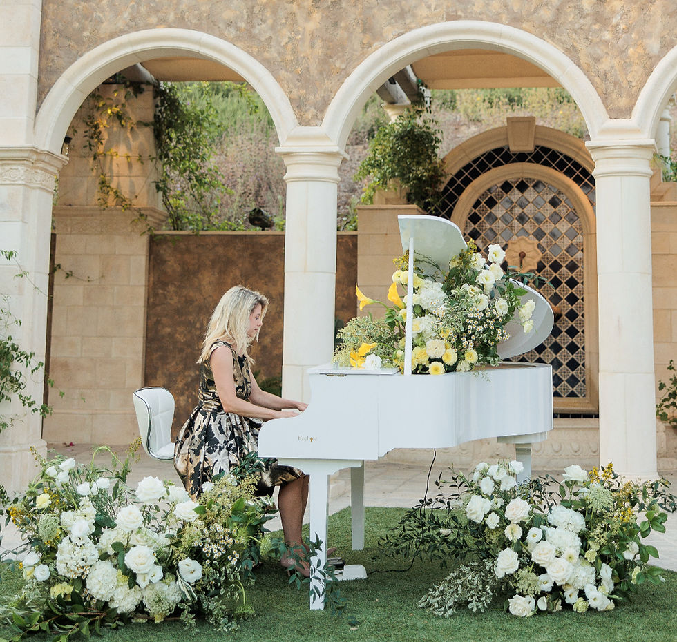 Eye-level view of a grand piano on a stage with soft lighting