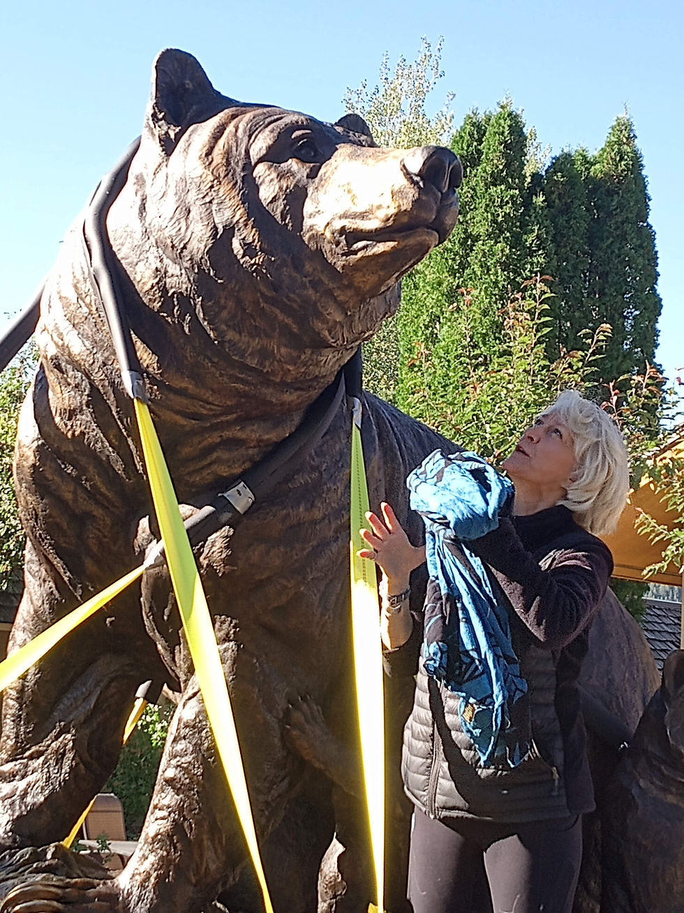 Jocelyn Russell with monument, in transit
