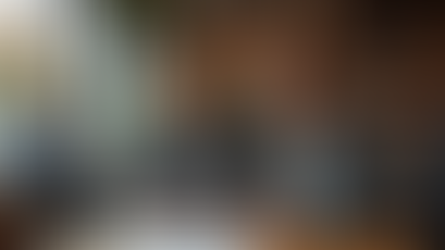 Professionals using voice assistant at UK café with SEO text on menu