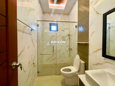 Bathroom with glass shower enclosure and modern fixtures