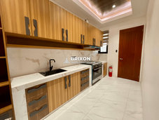 Fully equipped kitchen with wood and white cabinetry