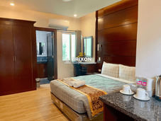 Condo-style hotel suite with living area, kitchenette, and sofa