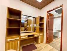 Dressing area with built-in vanity and wardrobe