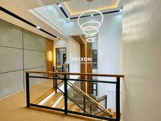 Second-floor hallway with high ceiling and LED lighting design