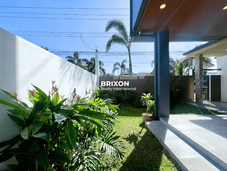 Front gate and landscaped entrance of luxury home near Clark Pampanga