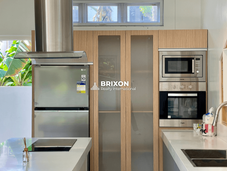 Fully equipped modern kitchen with built-in oven, microwave, and refrigerator – Brixon Realty Angeles City property.
