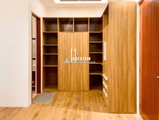 Walk-in wardrobe with built-in wooden shelves