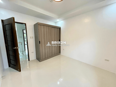 Bedroom with built-in closet and minimalist design.