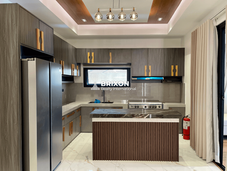 Stylish kitchen and breakfast counter with pendant lights