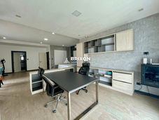 Home office area with dual workstations and built-in shelving.