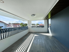 Wide balcony with outdoor seating space