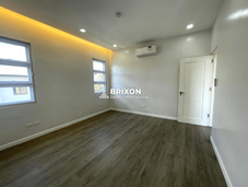 Guest or secondary bedroom with air conditioning and accent wall – modern home for sale Pampanga.
