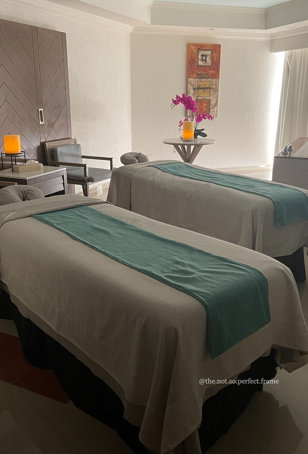 Close-up view of a tranquil spa treatment room with candles