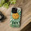 Thumbnail: Green phone case with sun and herbs