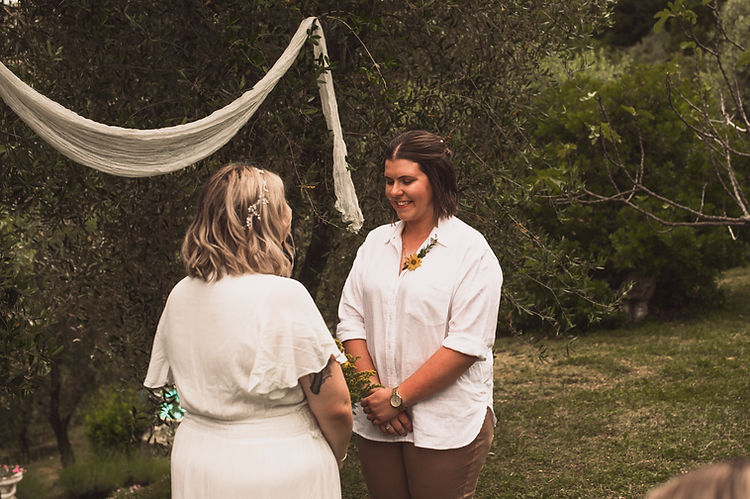 Italian wedding photography: a professional photographer captures a couple's intimate sunset vows in a stunning Tuscan vineya