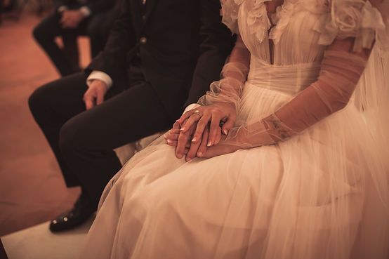 Italian wedding photography: a professional photographer captures a couple's intimate sunset vows in Tuscany (Italy)