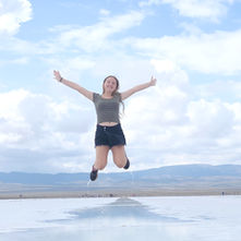 Amelia Kerlin jumping over water in Argentina