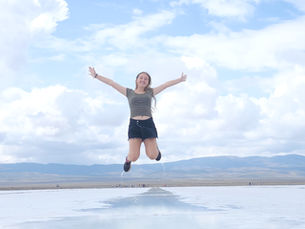 Amelia Kerlin jumping over water in Argentina