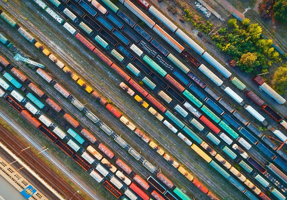 top-view-of-colorful-cargo-trains-aerial-view-e1665494888994.jpg