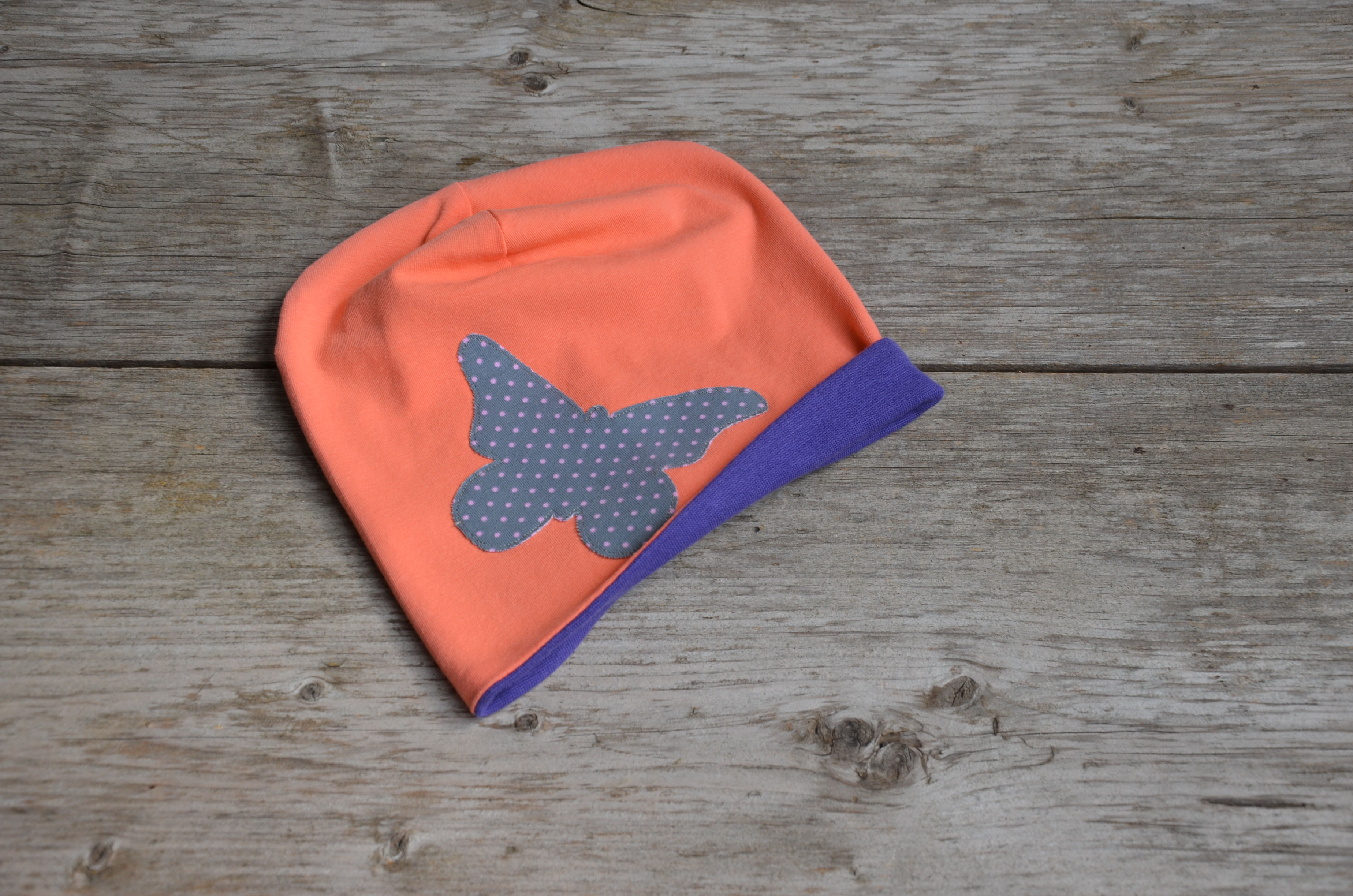 Wendebeanie koralle/lila