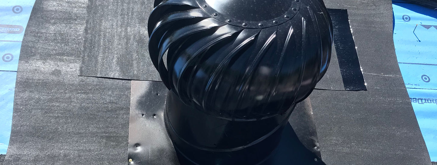 A vent with water shield wrapped around it.
