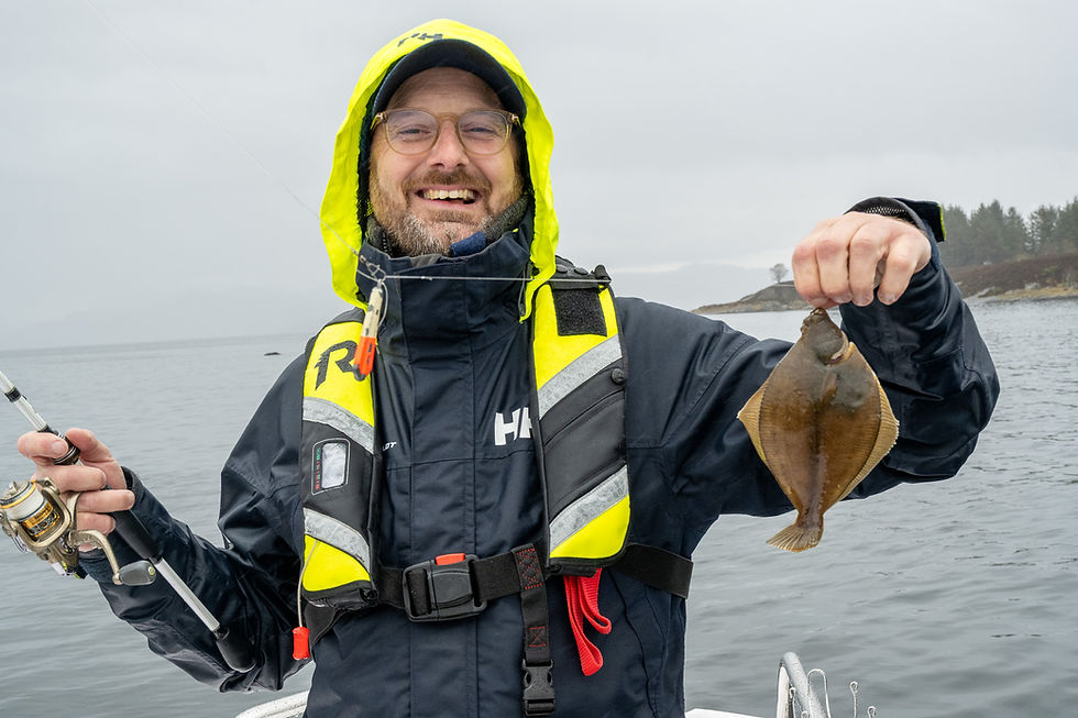 Private fishing guide in Stavanger catching flounder in calm fjord conditions