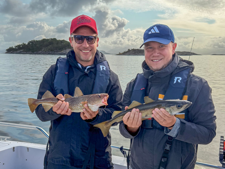 Two guests showing their catch after fishing in the waters around Stavanger