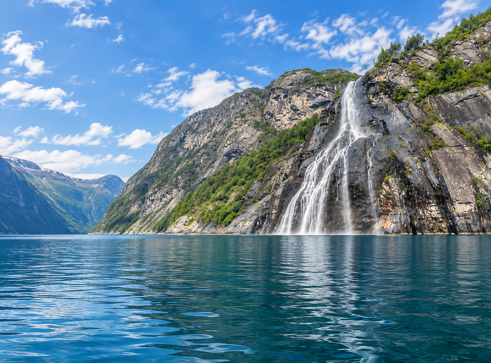 Waterfall cascading down the steep cliffs into the calm waters of Lysefjord.