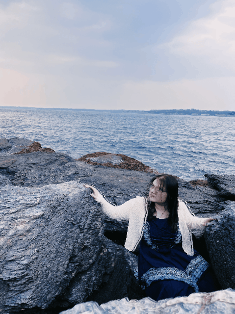 devin rain on rock glitching ocean gif
