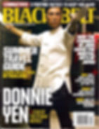 Martial artist in traditional attire poses with a sword on a magazine cover. Headlines include self-defense tips and travel guides. Bold text.