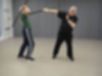 two men fighting with Irish sticks