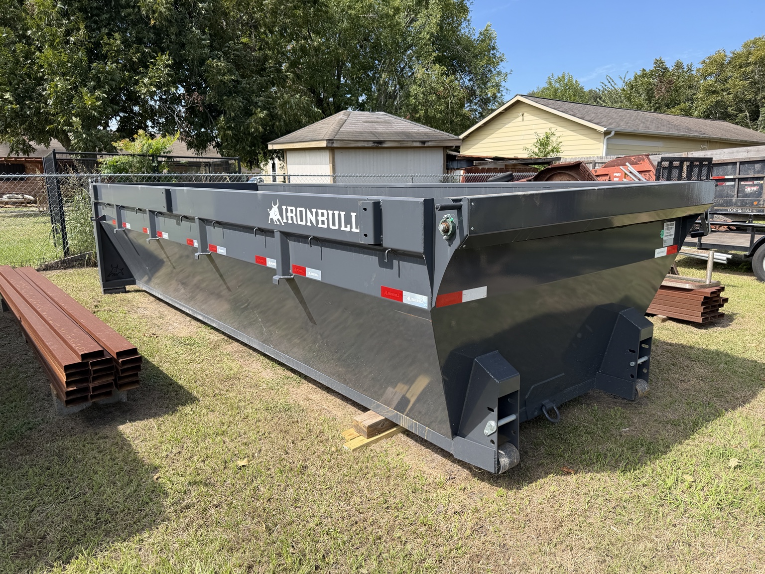 Actual IronBull roll-off dumpster used by Rain Day for dumpster rental in Katy, Texas