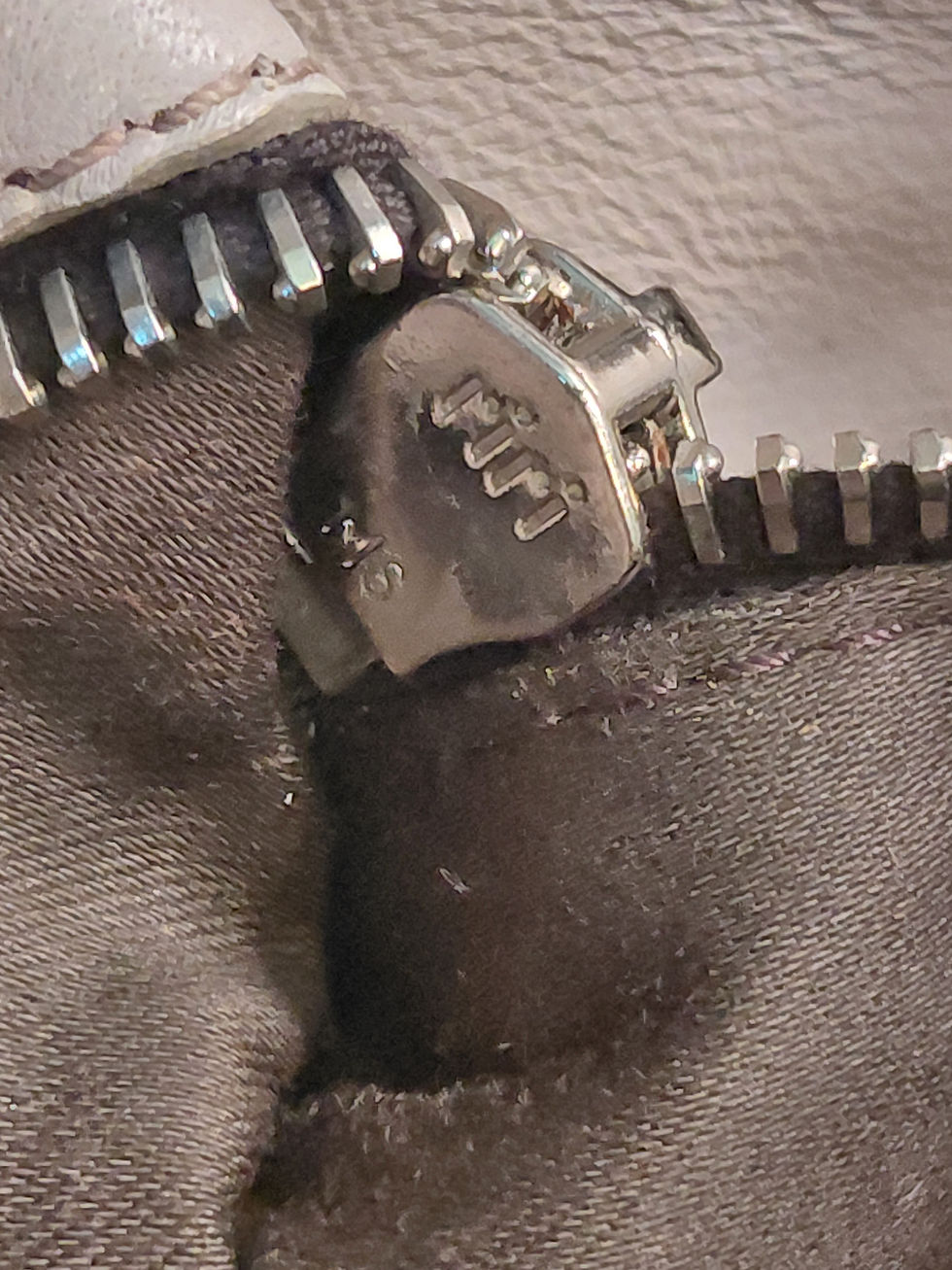 Thumbnail: Close up of RiRi authentic zipper