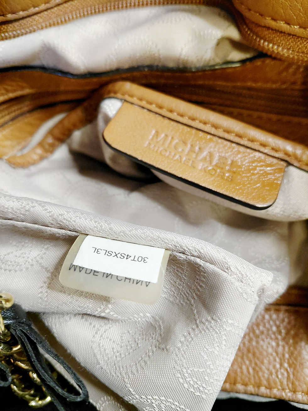 Thumbnail: Michael Kors interior label and lining inside brown leather shoulder bag.
