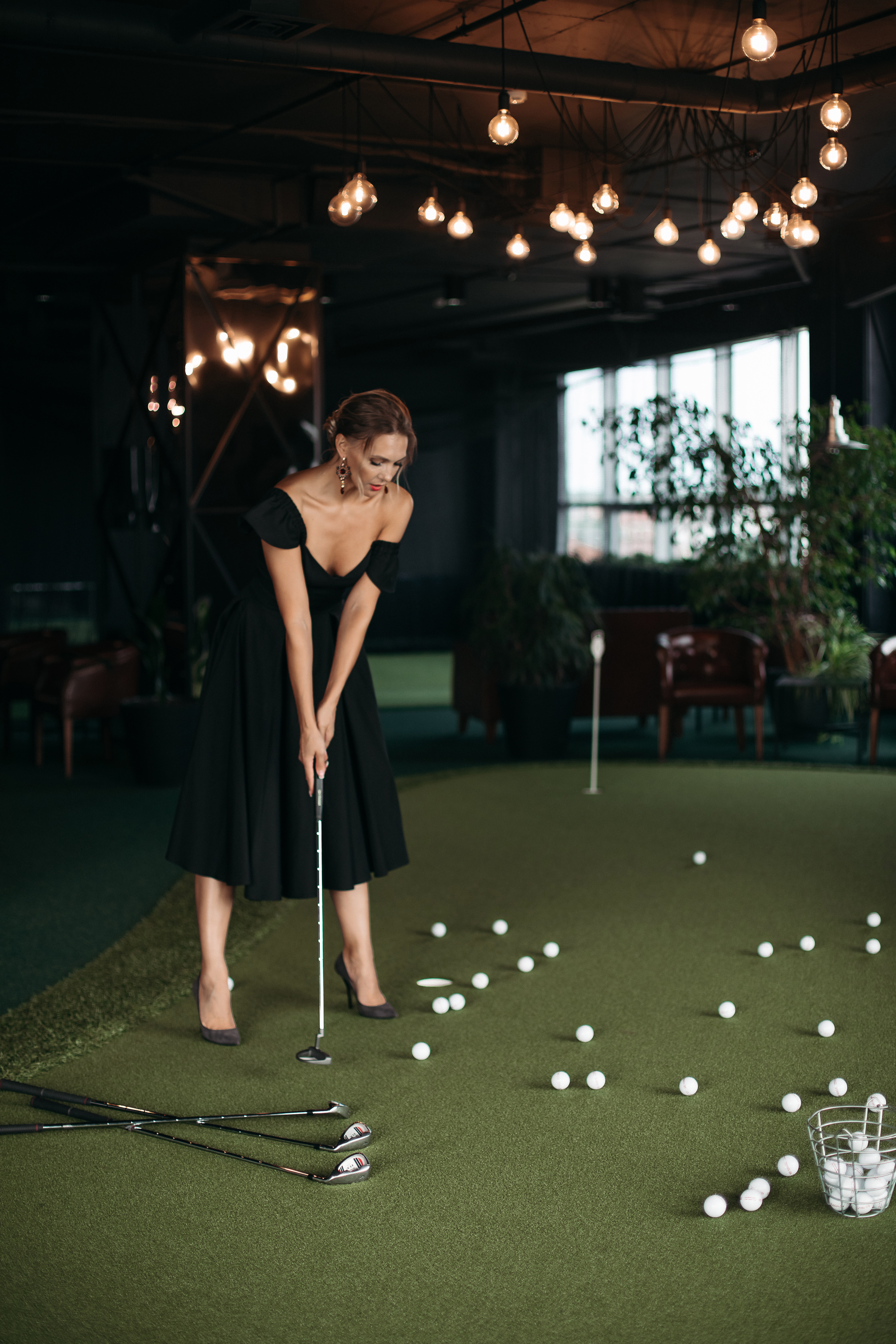 charming-caucasian-lady-poses-camera-plays-golf-picture-isolated-dark-blur-background.jpg
