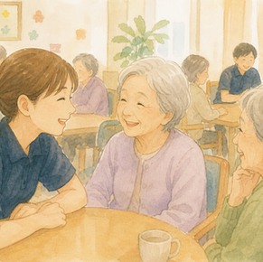 老人ホームで入居者である高齢者の方々と楽しそうに話すスタッフ