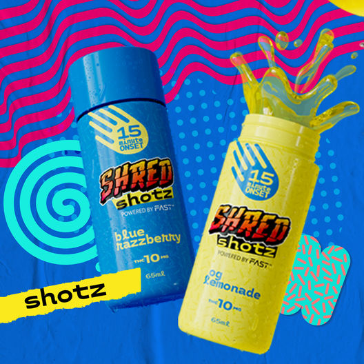 Two SHRED Shotz: Blue Razzberry in a blue container, and OG Lemonade in a bright yellow container.