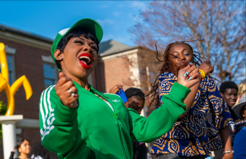Attendees dance during the Love is on the Green Line kickoff celebration on May 3, 2026, in the Austin neighborhood of Chicago. The event marks the start of a monthly series that will travel south along the Green Line, activating different stops and celebrating connection across the West and South Sides. (Kenn Cook Jr.)