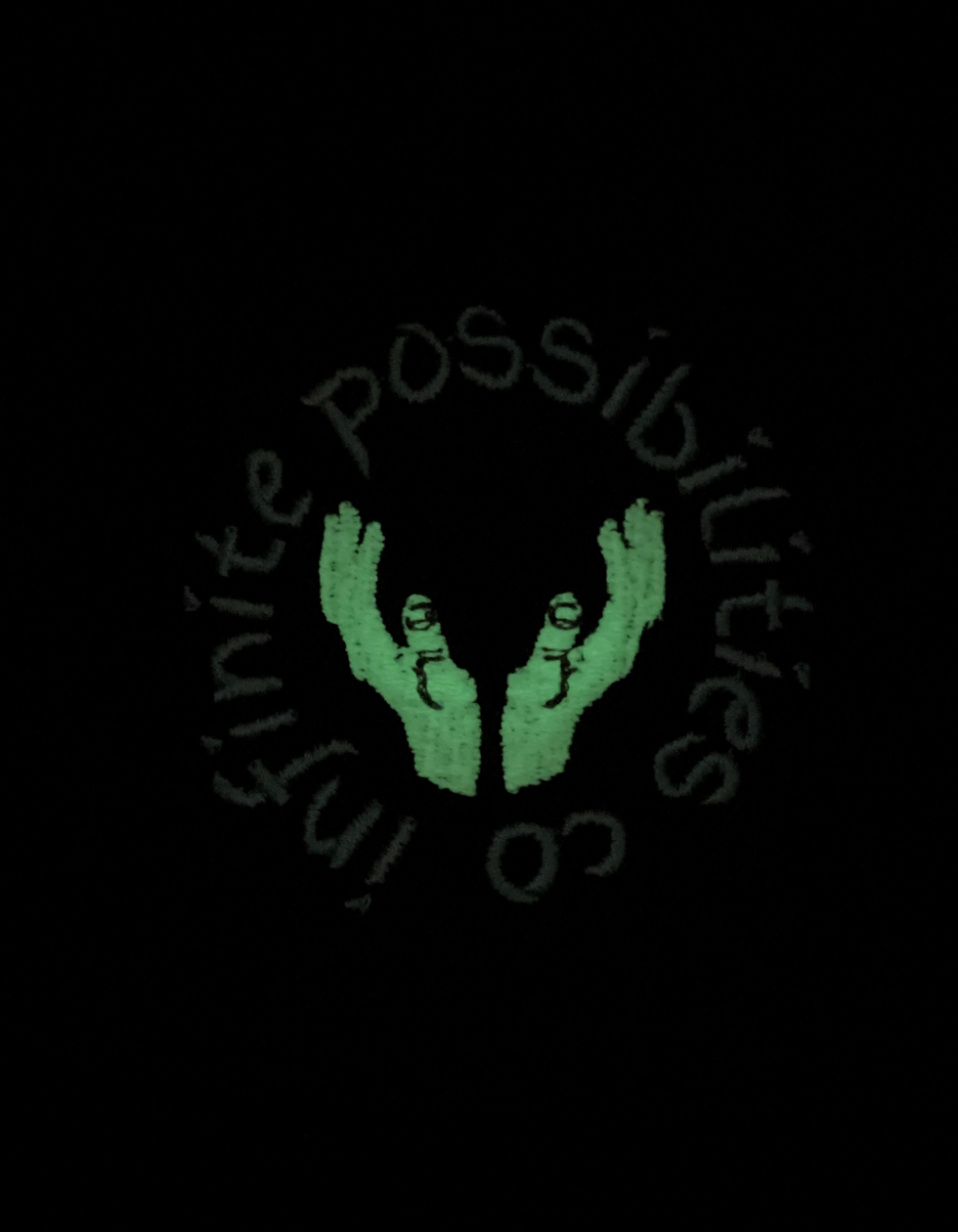 Thumbnail: hands infinite possibilities Co glow in the dark snap back