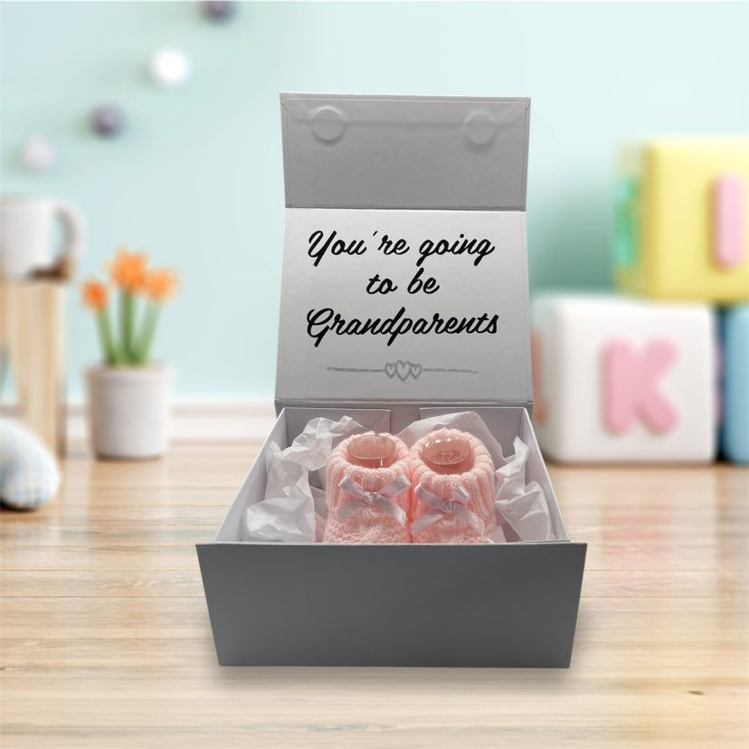 Thumbnail: Pregnancy Announcement white magnetic box containing booties and wording you're going to be Grandparents.