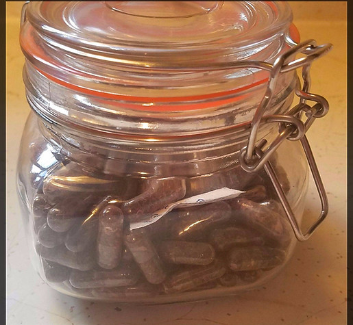Glass jar of placenta capsules. When clicked, leads to Placenta Encapsulation page page.