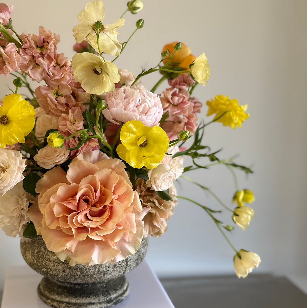 Elegant peach and yellow floral arrangement